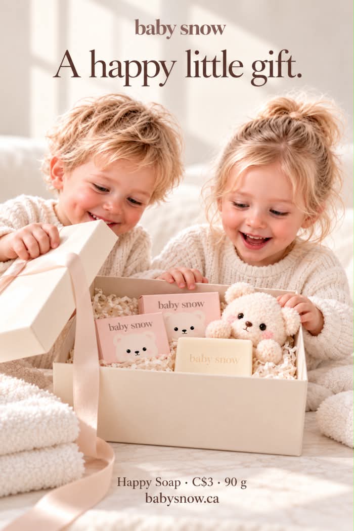 Two children opening a Baby Snow gift box